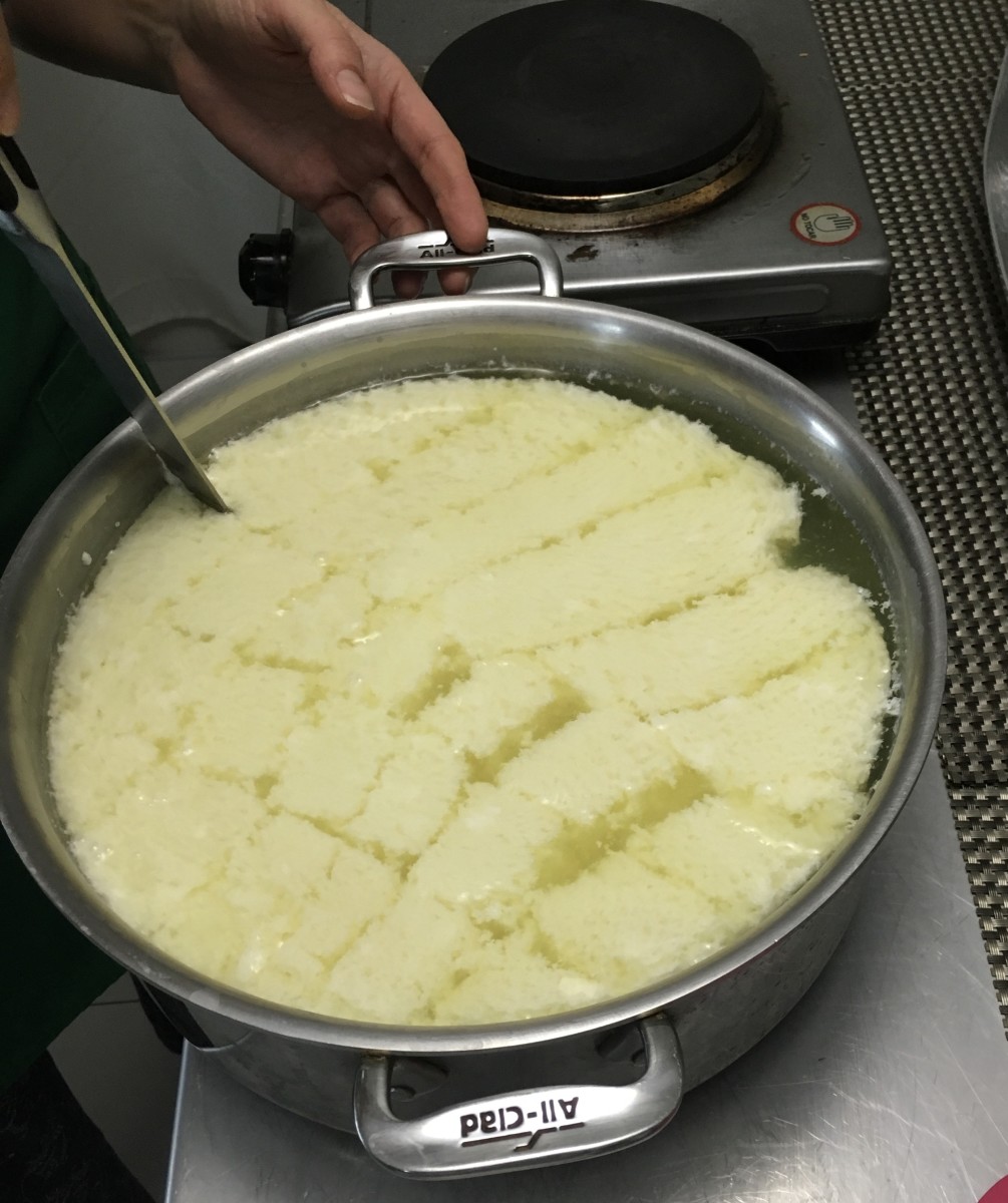 Use a long knife to cut the curd in a criss-cross pattern
