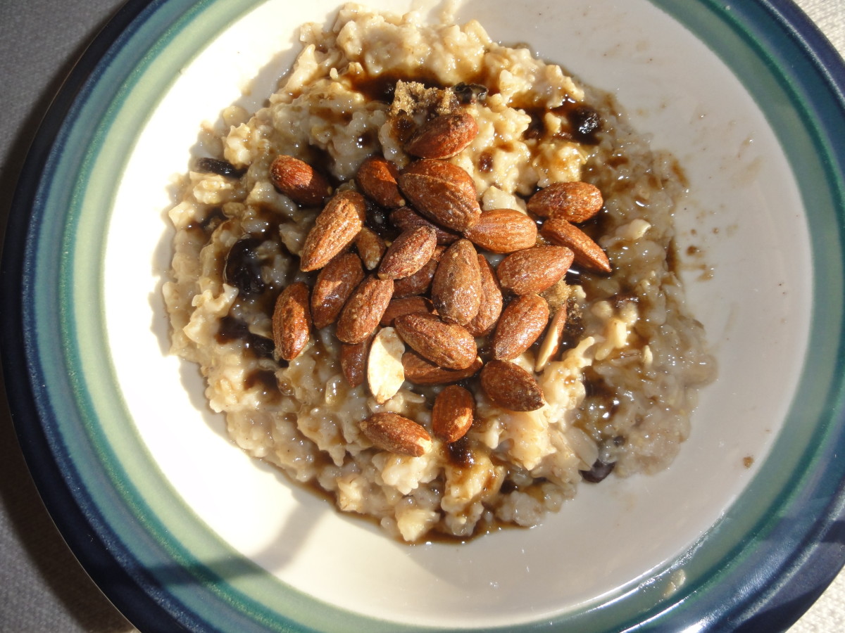 Oatmeal topped with brown sugar and almonds.
