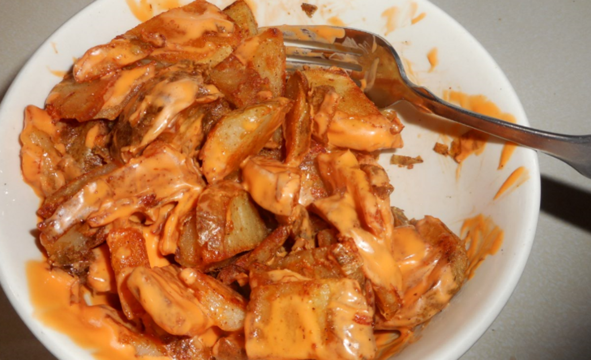 Cover the potatoes with buffalo wing sauce.