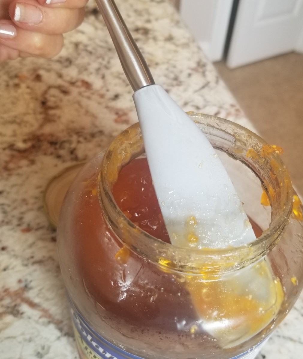 This Flex-Core Jar Spatula with Stainless Steel Handle from Sur La Table fits into narrow jars and helps me spread jam on dough easily.