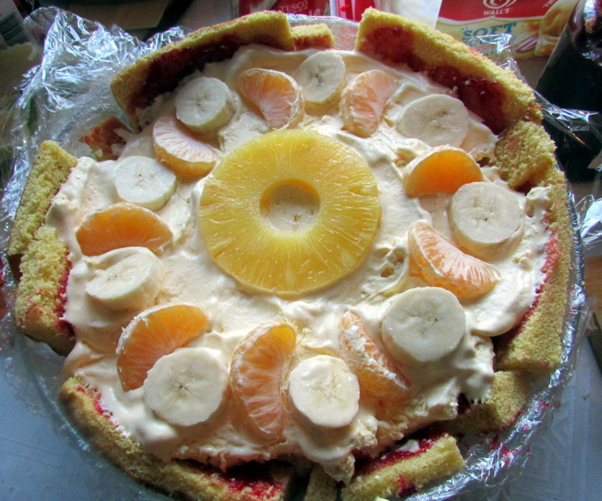 Add another layer of pineapples with some orange segments and banana slices.