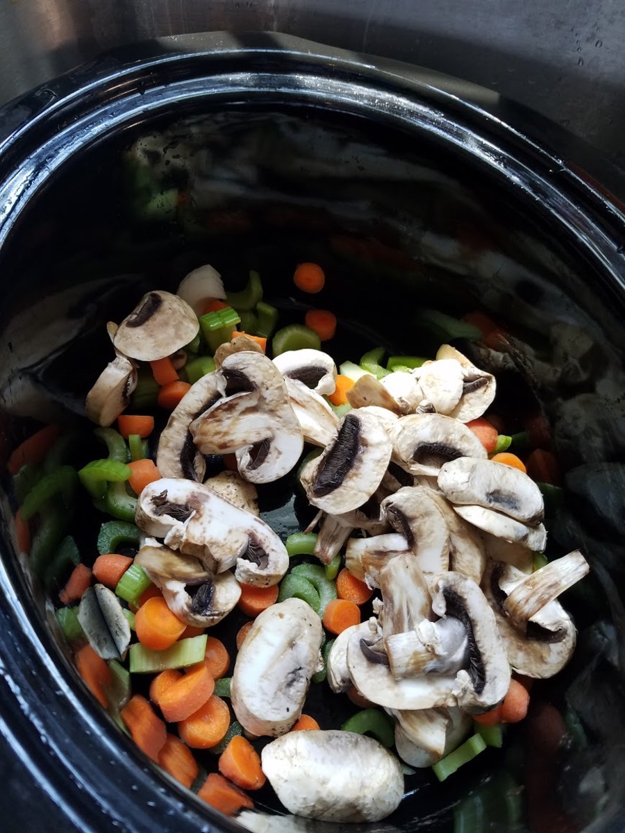 Chop up your vegetables and add them to the slow cooker.
