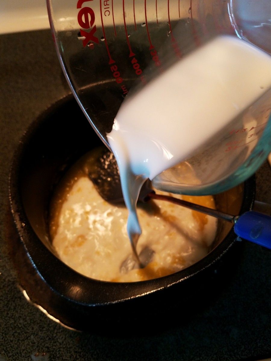Stir milk into melted butter and flour mixture.