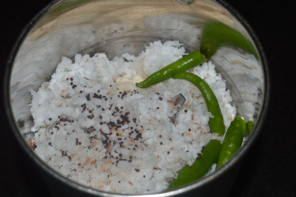 Step 2: Grind grated coconut, mustard seeds, and green chilies, adding water to get a smooth paste.