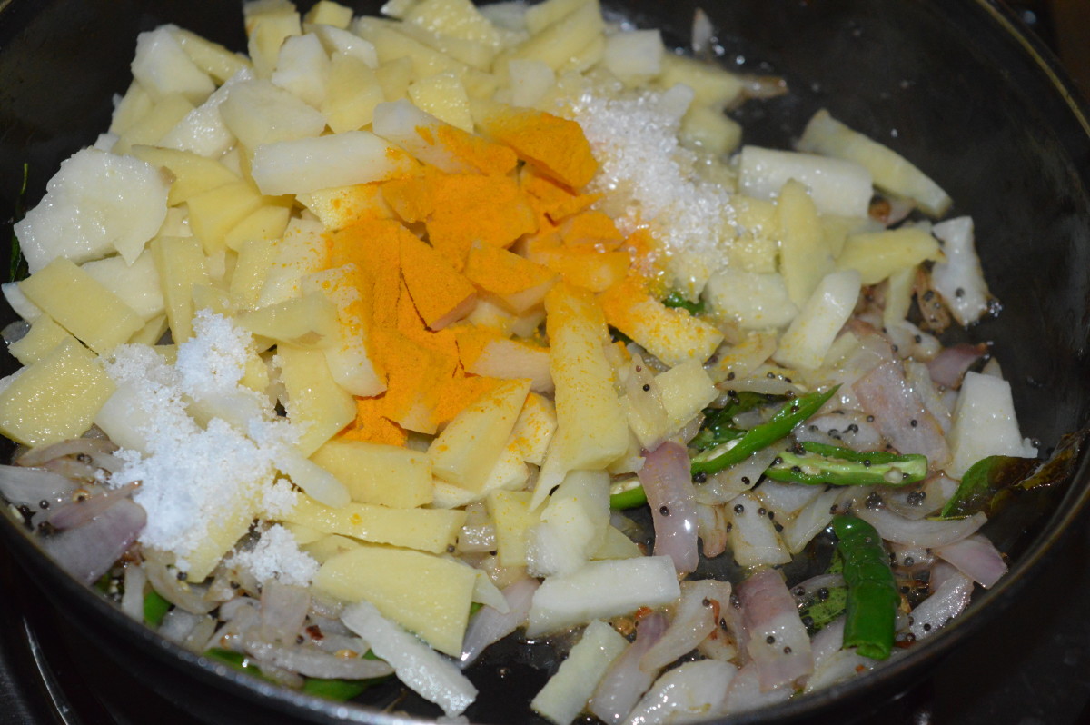 Step 5: Add chopped potatoes. Stir-cook on low fire for 2 to 3 minutes. Add turmeric powder, sugar, and salt.