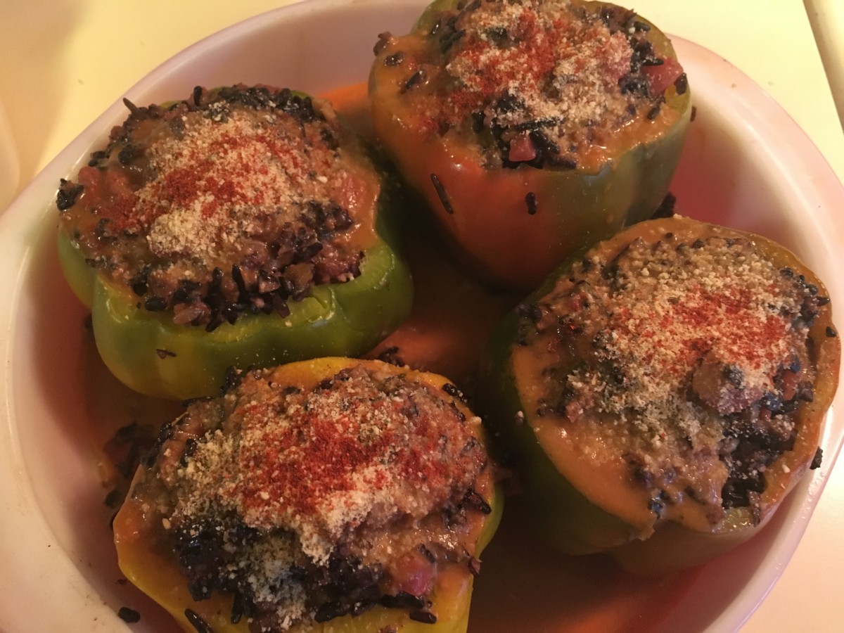 Top peppers with red pepper and tomato soup, bread crumbs, Parmesan cheese, and paprika.