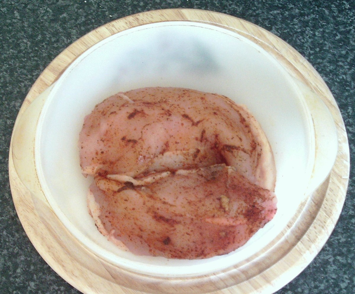 Chicken breasts are simply seasoned before being baked in a casserole dish