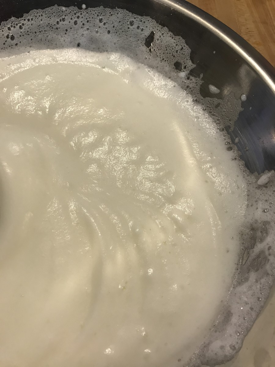 Once you've gotten volume into the egg whites, it's time to add the sugar—slowly—to make sure you don't deflate them. Too much too soon, and the egg whites could collapse, so work slowly and carefully.
