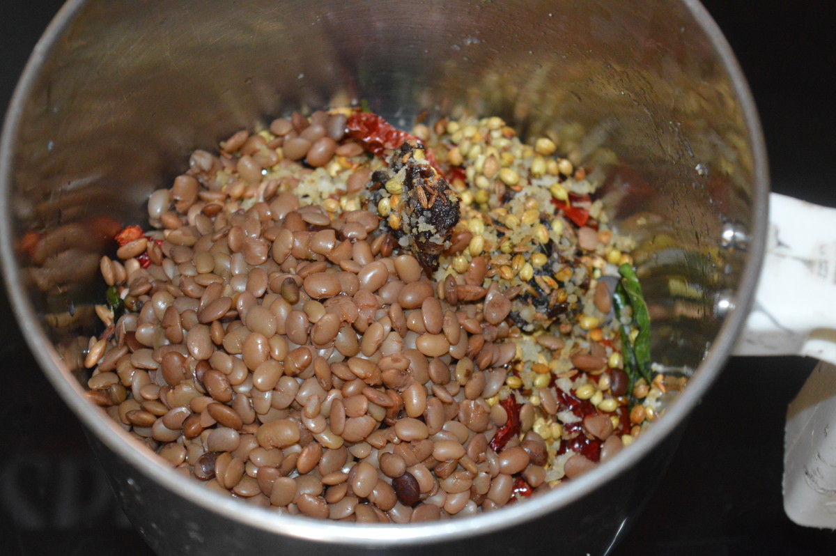 Step four: Grind spice mix, some cooked horse gram, and tamarind, adding water little by little to get a smooth paste. 