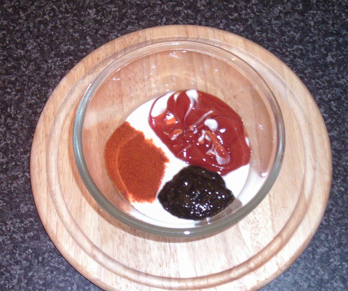 Combining spicy sauce ingredients.