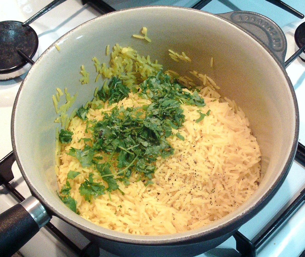 Coriander is added to turmeric rice