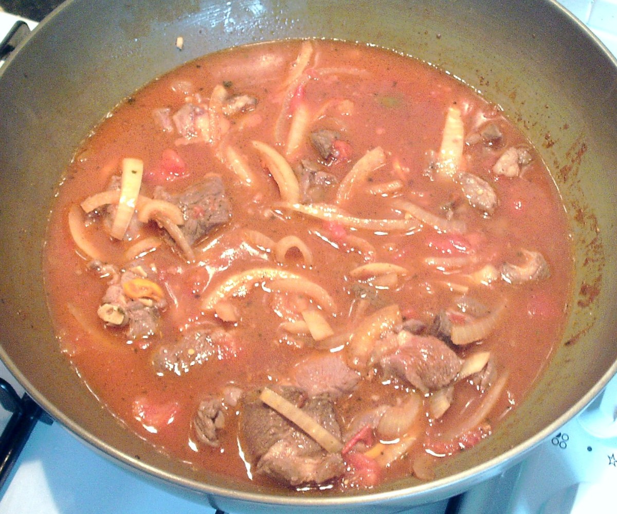 Stock is added to karahi and brought to a simmer