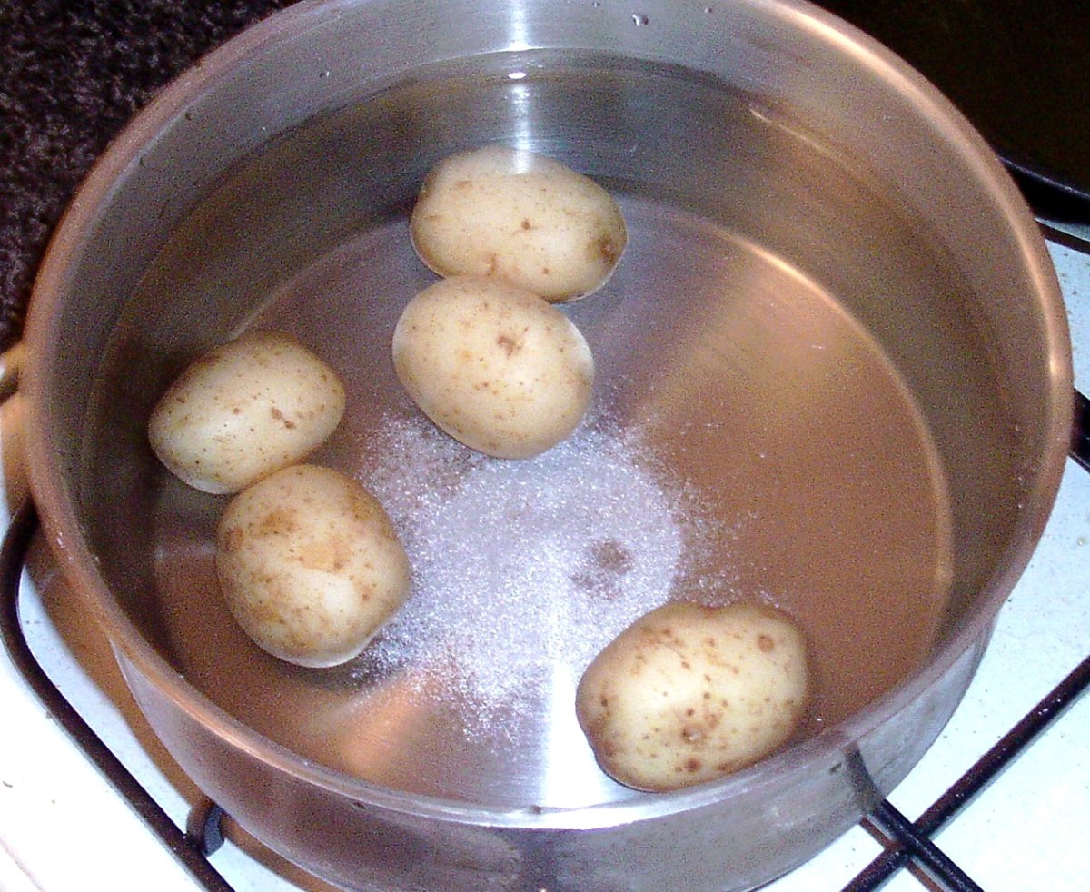 Baby new potatoes are put on to cook by boiling