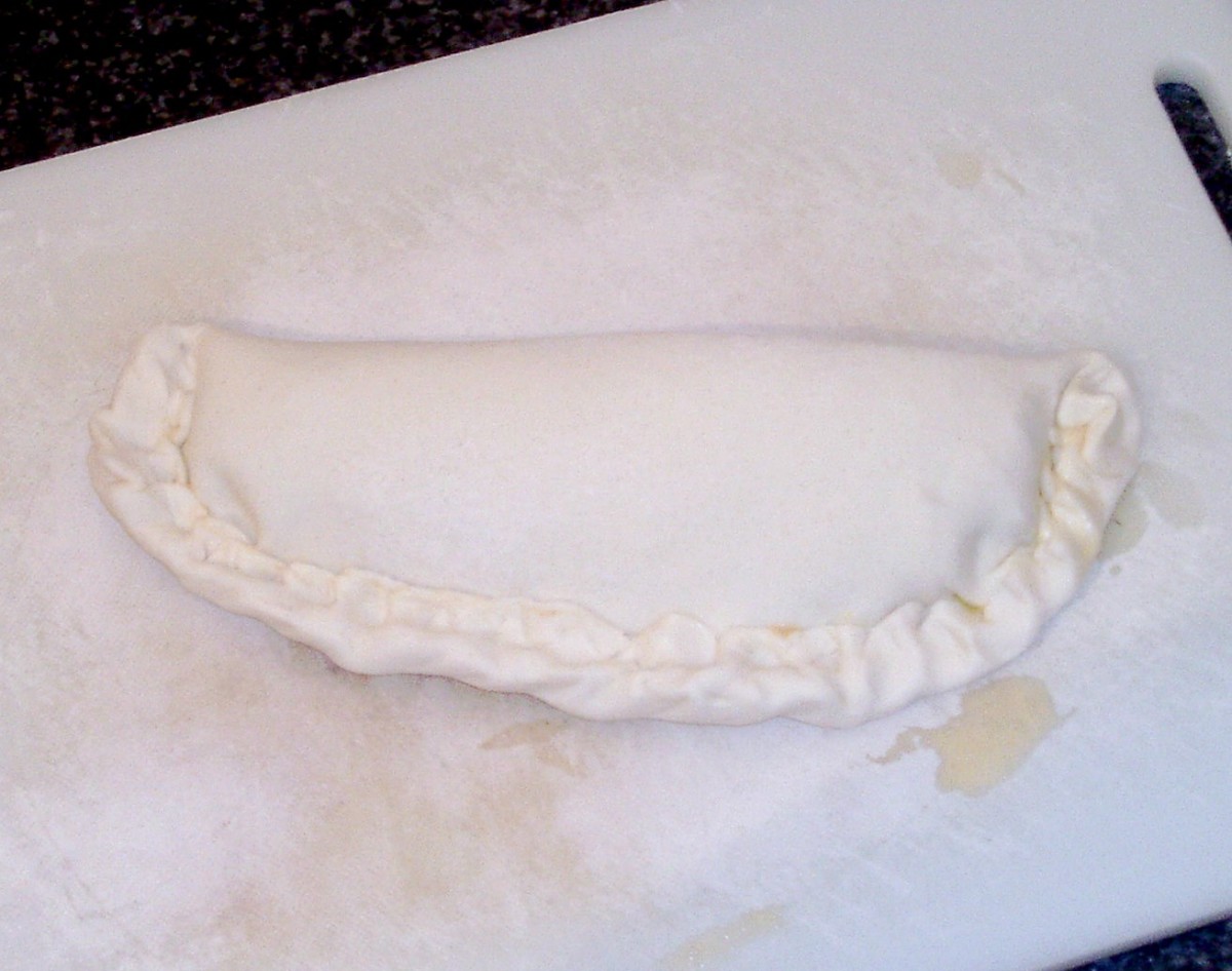 Pastry is folded over sea bass and crimped