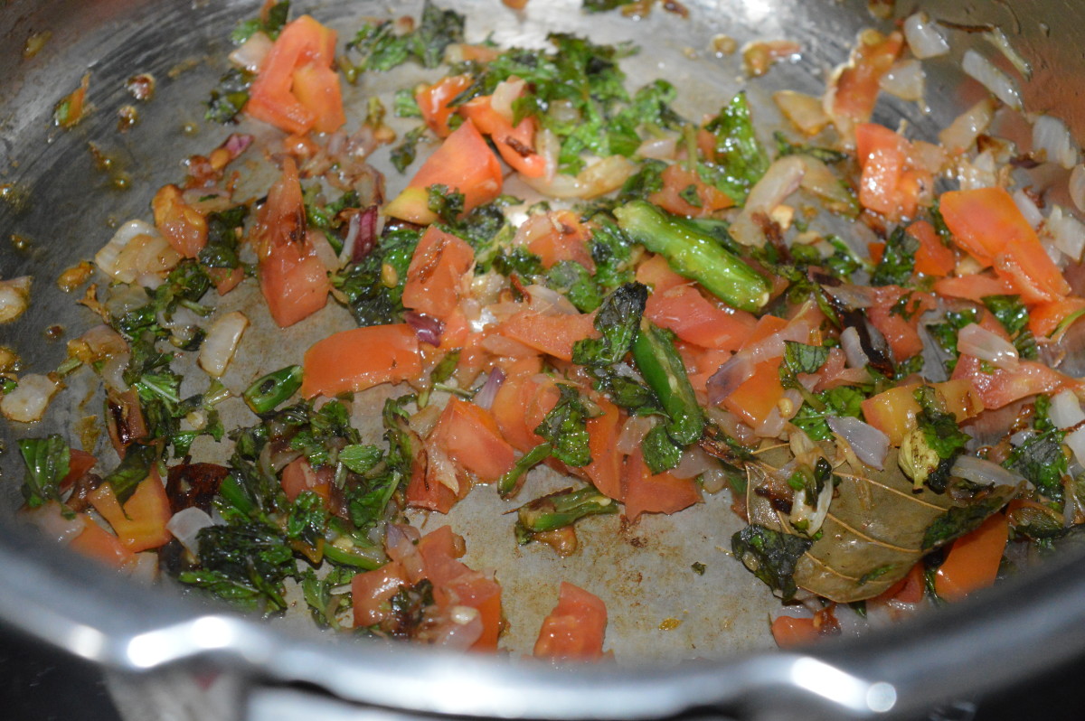 Step four: Throw in chopped tomatoes, mint leaves, and turmeric powder. Saute till tomatoes become a bit mushy.