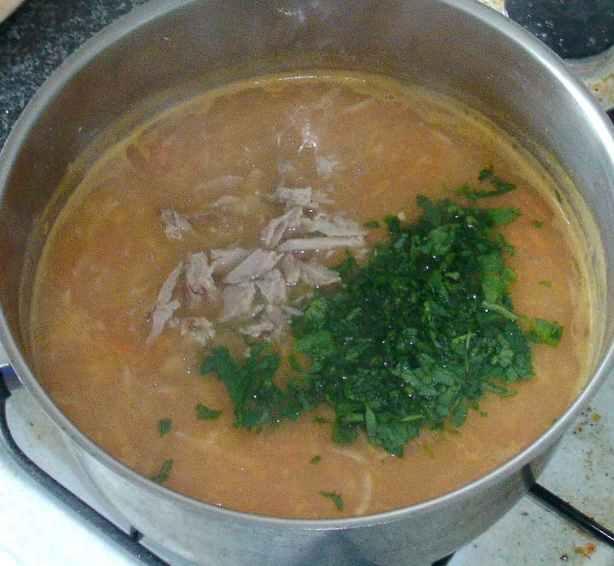 Pheasant meat and parsley are added to soup