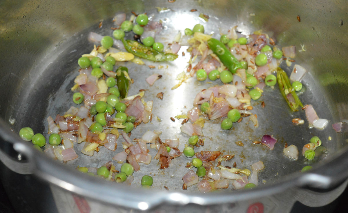 Step four: Add green peas. Throw in some salt. Saute together for 1 minute.