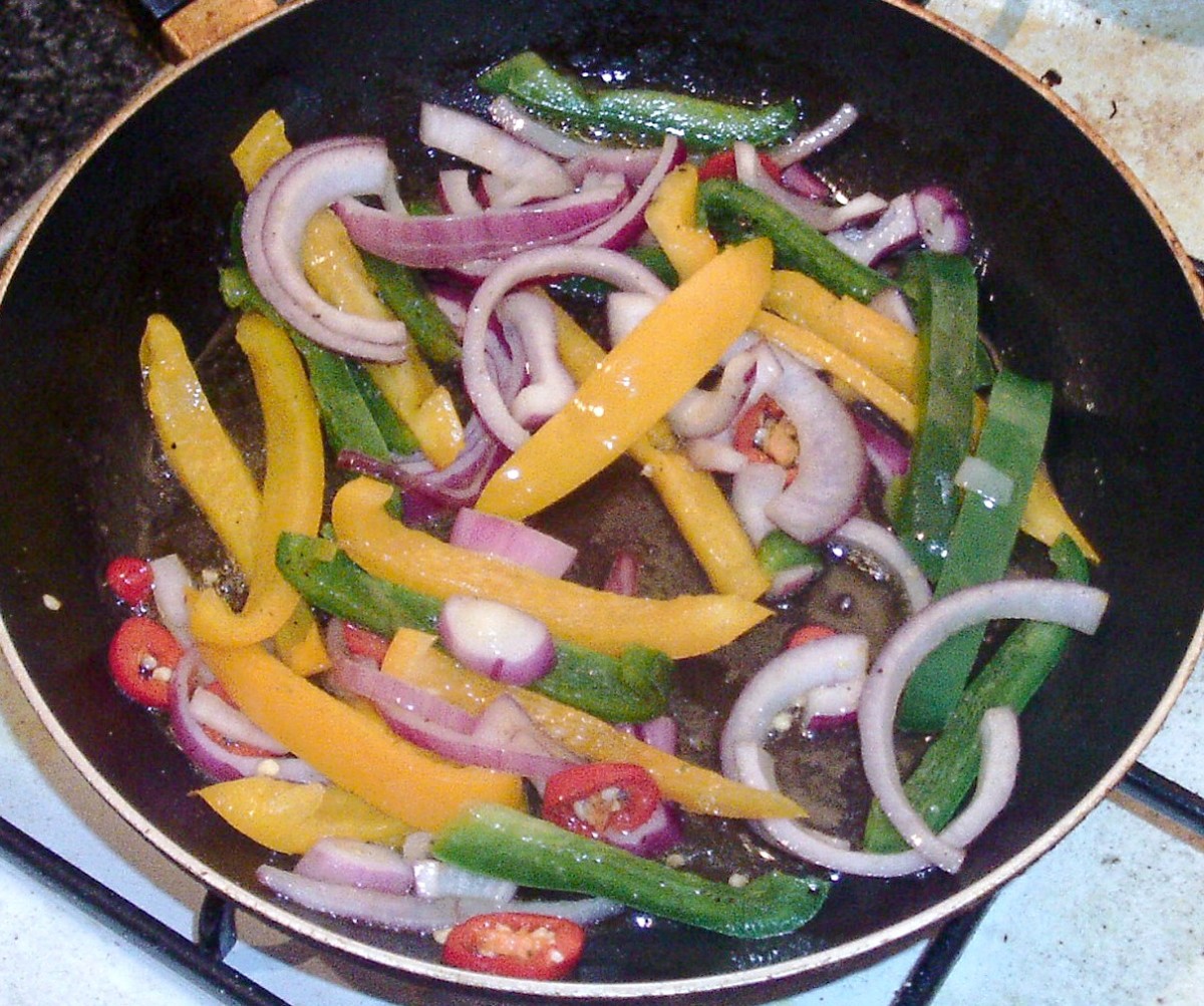 Peppers and onions are quickly stir-fried.