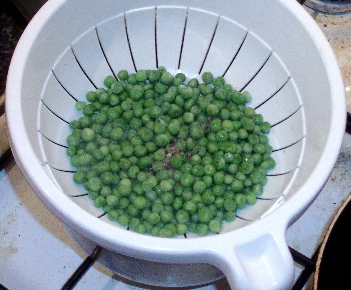 Peas are drained and seasoned.