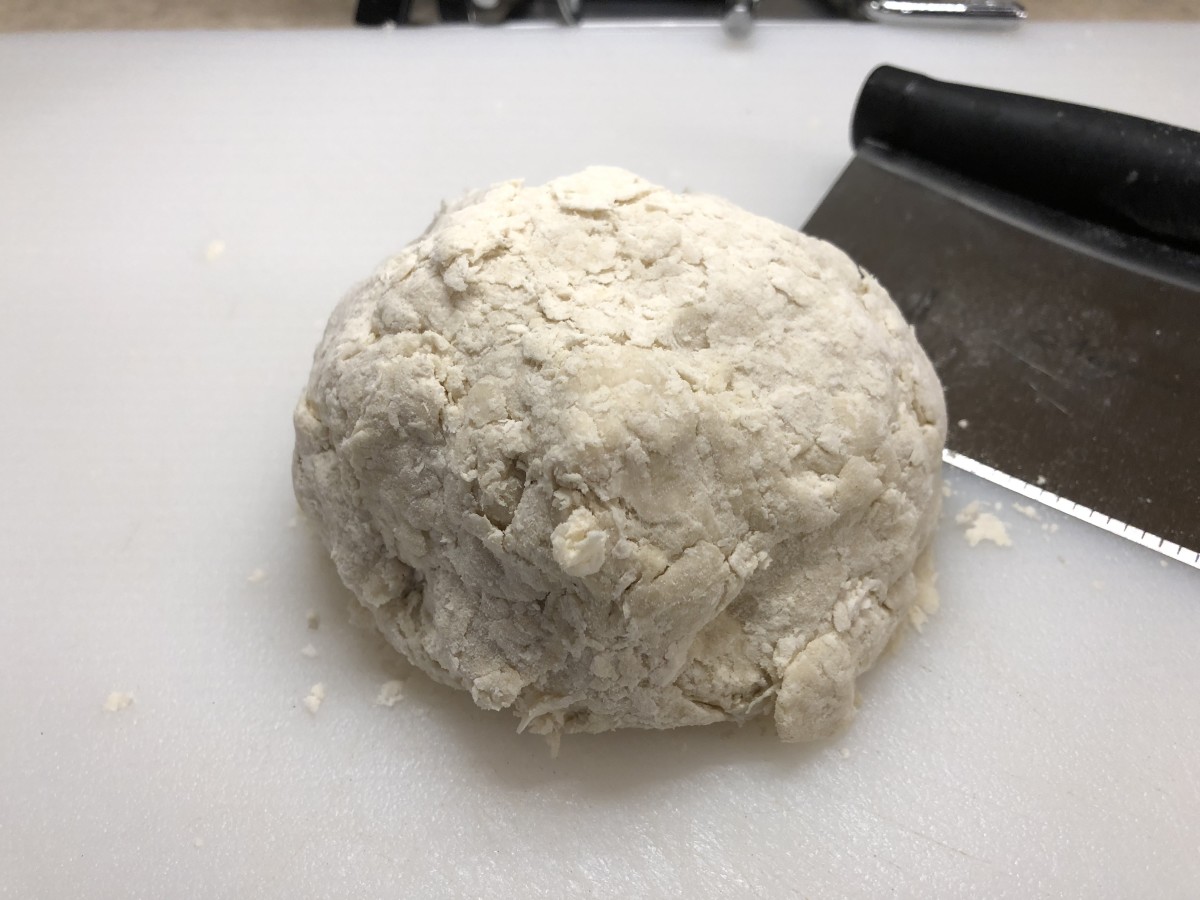 This is a very stiff dough, don't worry though, it will come together nicely when we roll it out.