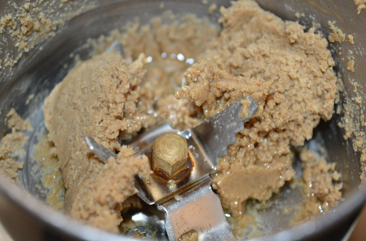 Step three: Add olive oil in batches. Grind together. Now, you will get a smooth paste.