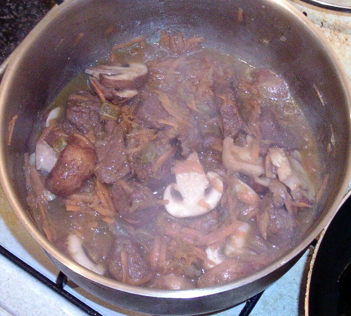 Stir carrot and mushrooms into stew