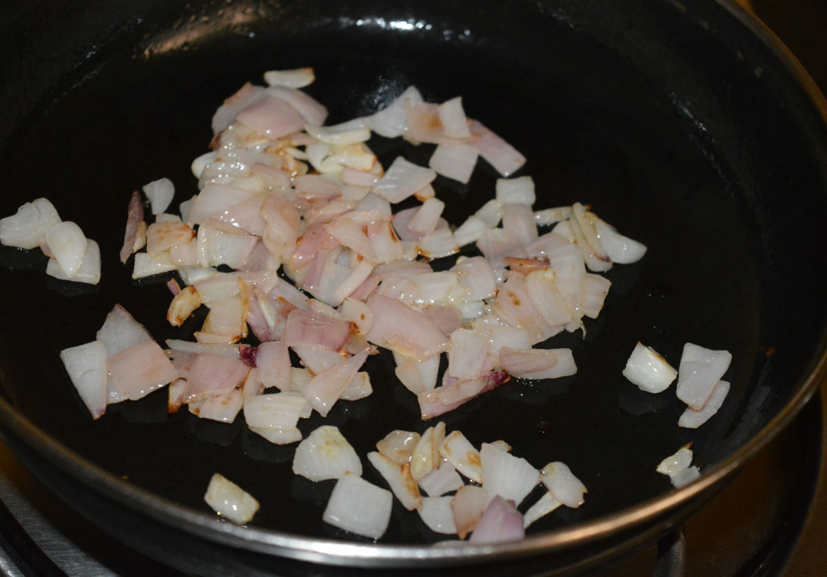 Step two: Heat olive oil in a deep-bottomed pan. Throw in chopped onions. Saute them until they are transparent.
