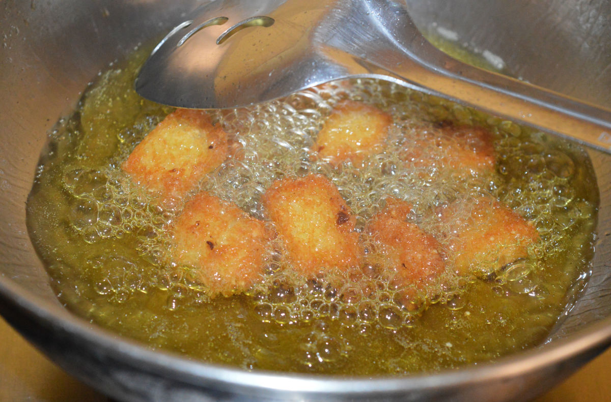 The idlis are almost done frying.