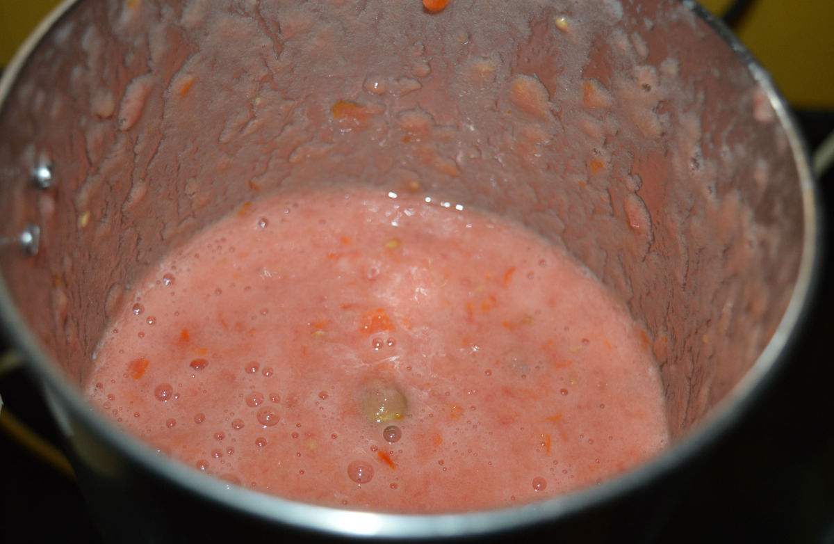 Grind to make a puree. See that there are a few chunks or pieces of tomatoes left in the puree. Don't grind it smooth.