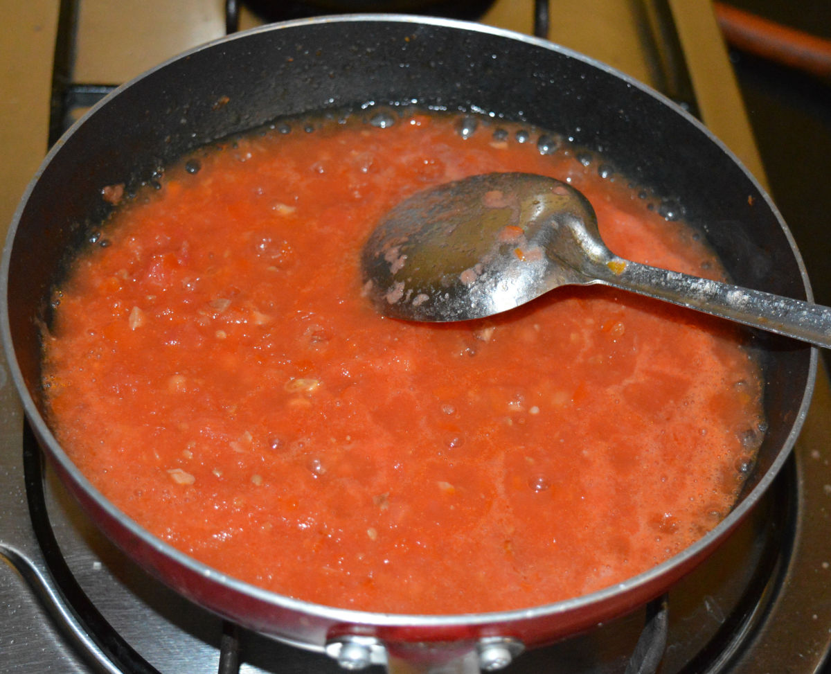 Different stages of sauteing tomato puree.