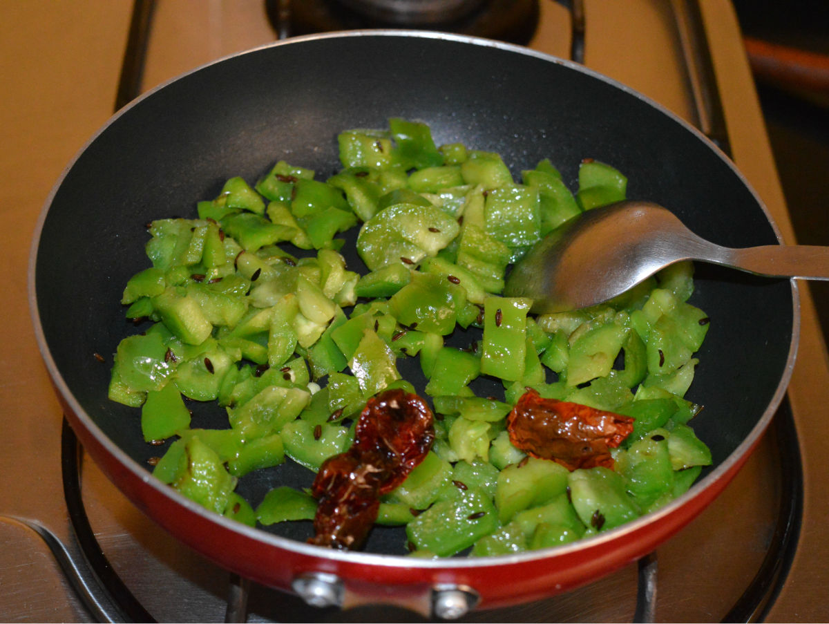 Step two: Add chopped capsicum and some salt.