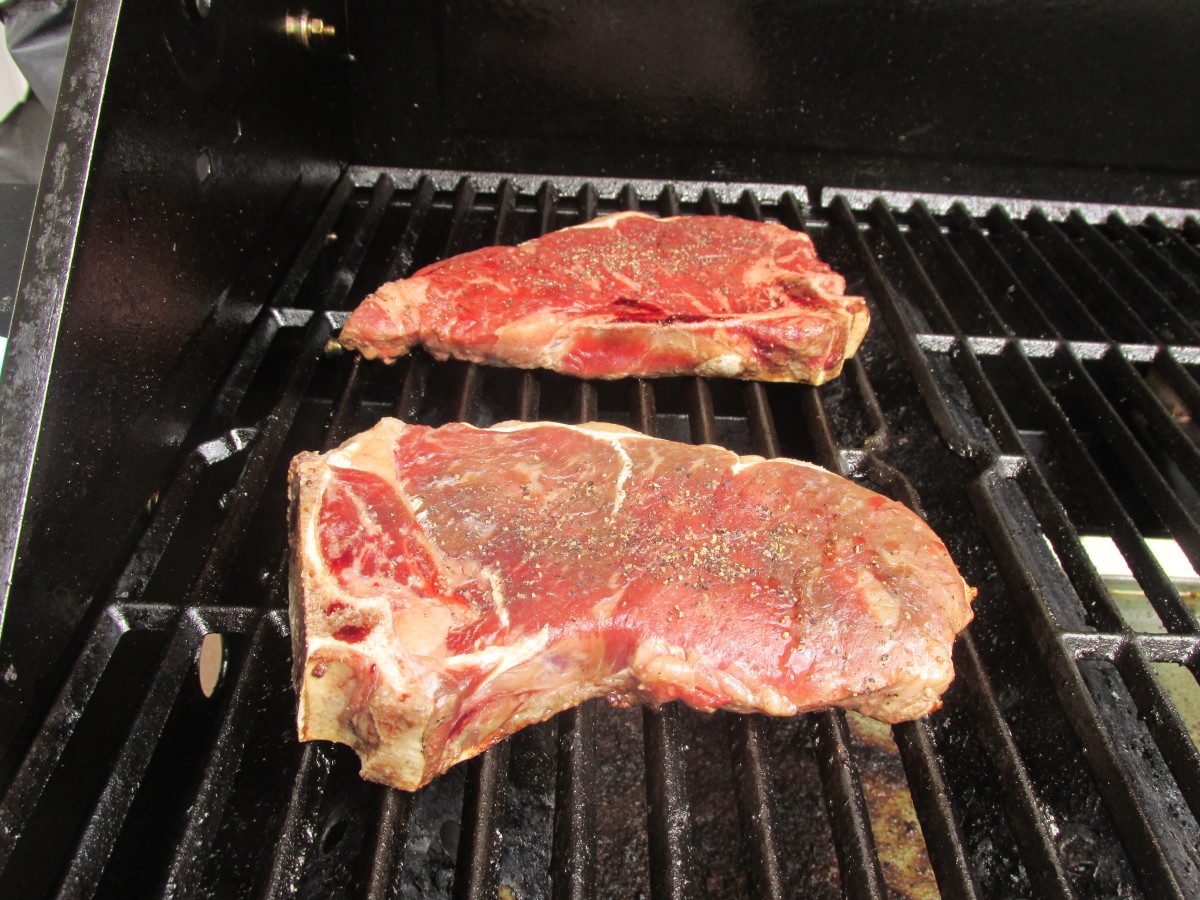 Cooking the steaks on the grill.