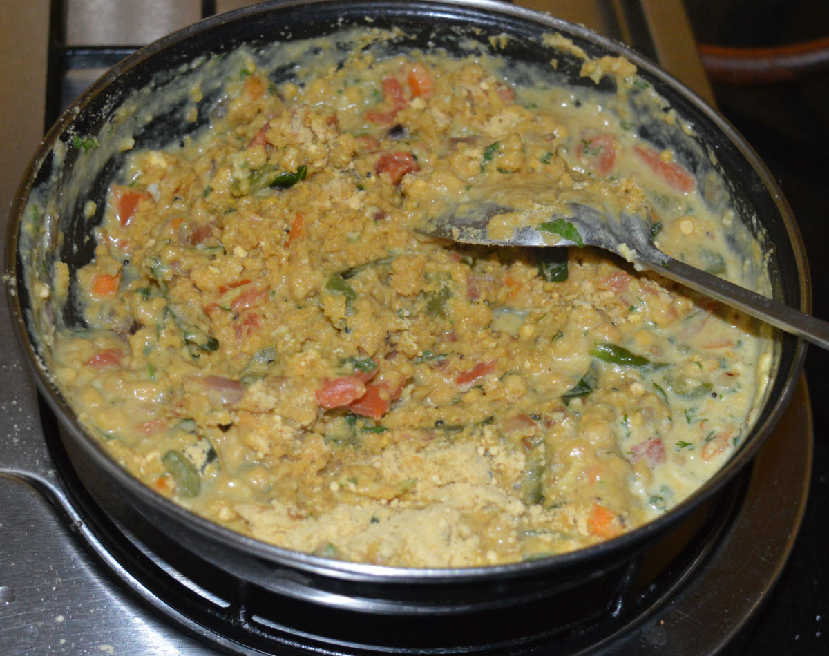 Step seven: Add cornmeal. Stir-cook continuously, until the mixture becomes thick and gets cooked. Add water, if needed.