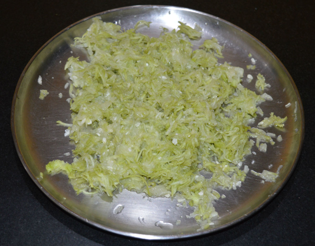 Step one: Grate bottle gourd. Squeeze and remove some water from it. Collect the water.