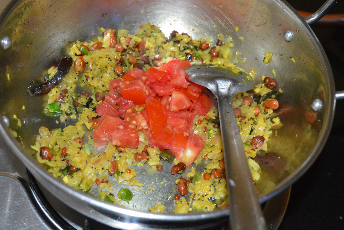 Step six: Add chopped tomatoes. Stir-cook until they are soft.