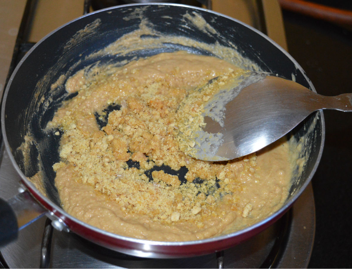 Step five: At this point, turn off the heat. Add jaggery powder and cardamom powder. Mix very well so the jaggery melts and combines with the mixture.