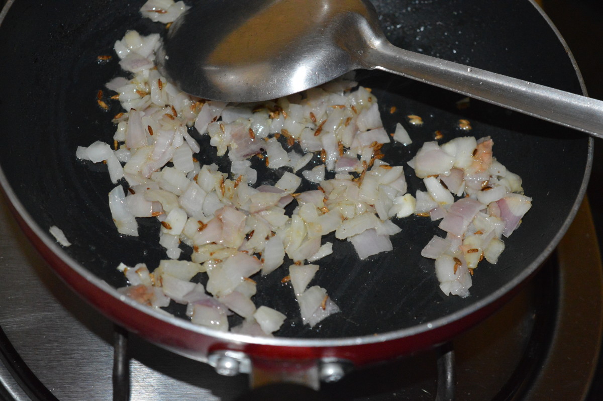 Step one: Saute cumin seeds in oil. Add chopped onions. Saute until they are transparent.