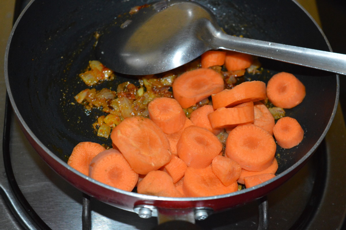 Step three: Add carrot slices. Arrange them on the base.