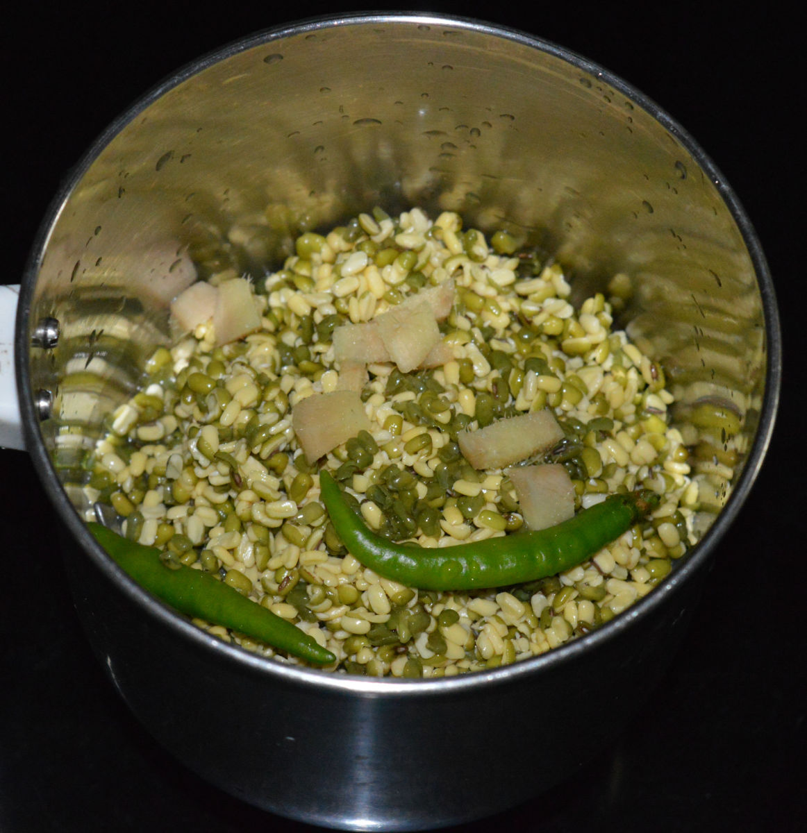 Step one: Grind soaked mung beans, chopped ginger, and green chilies in a mixer or blender to get a smooth, thick batter.