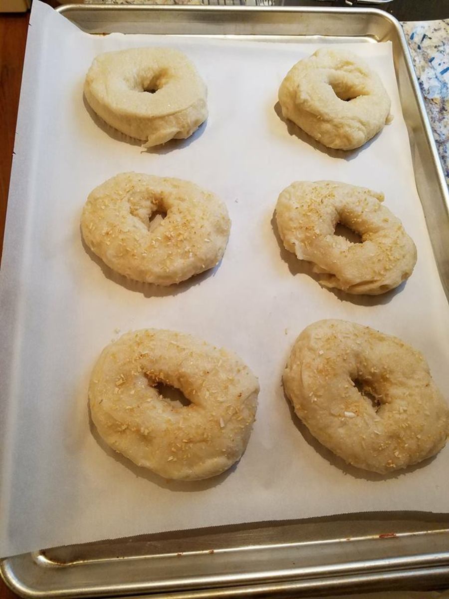 Topping the damp bagels.