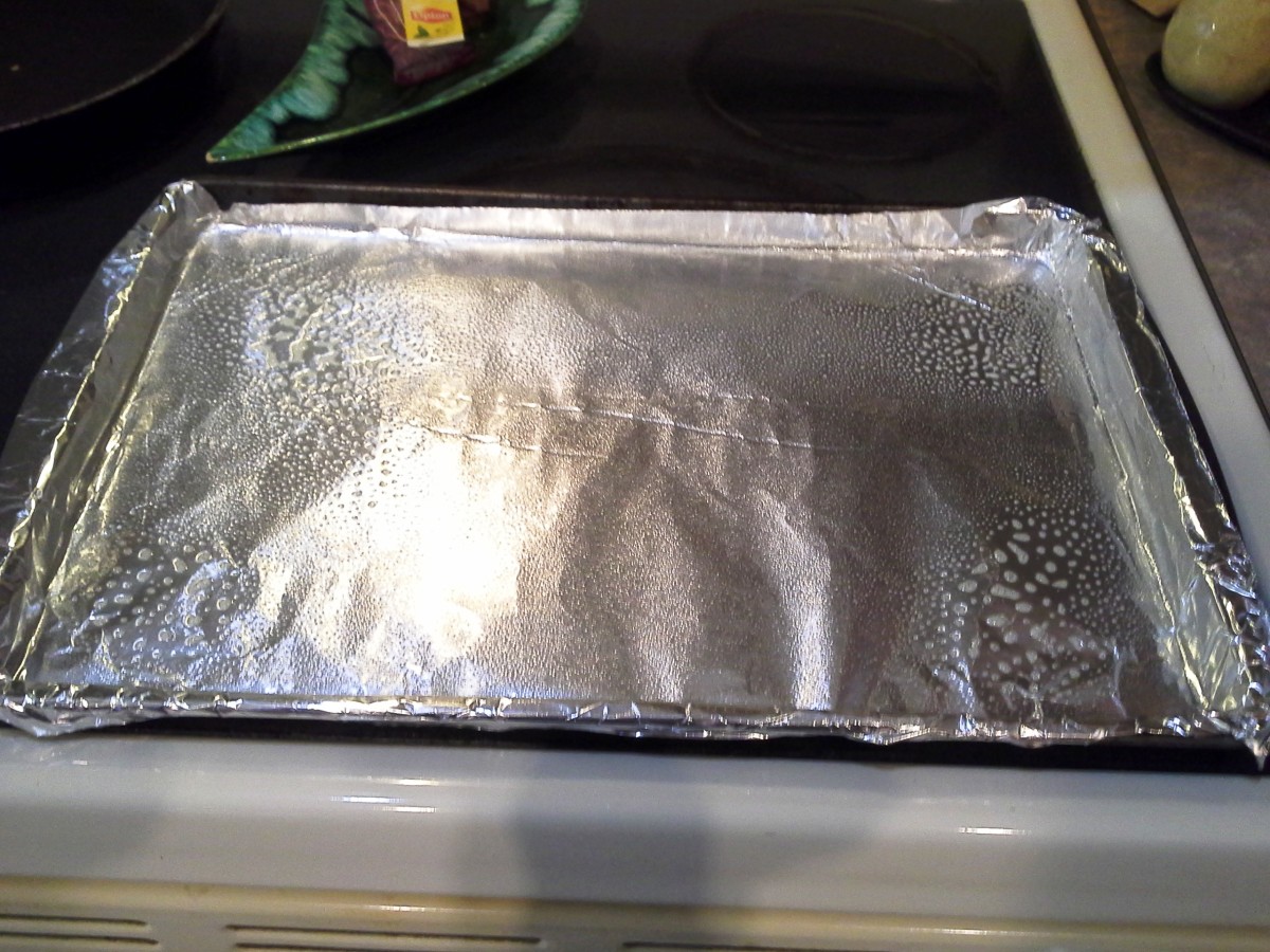 Line a cookie sheet with aluminum foil and spray it thoroughly with cooking spray.
