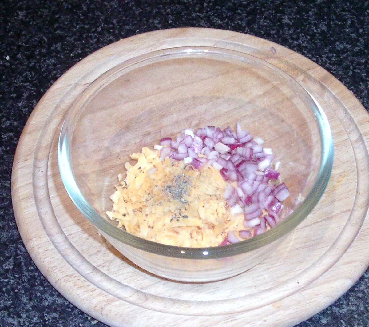Preparing cheese and onion burger topping