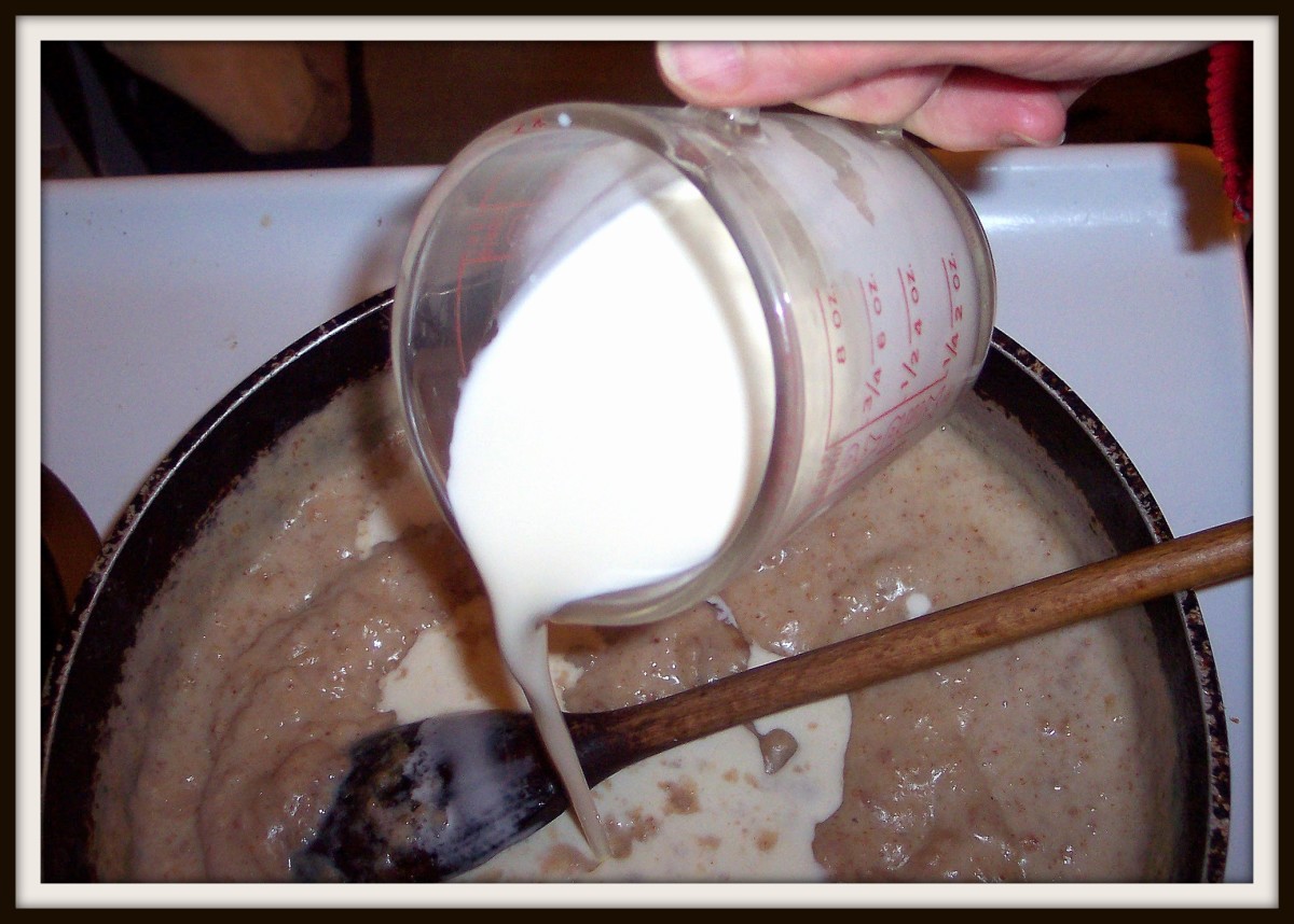 Slowly stir in the milk and then the cream.
