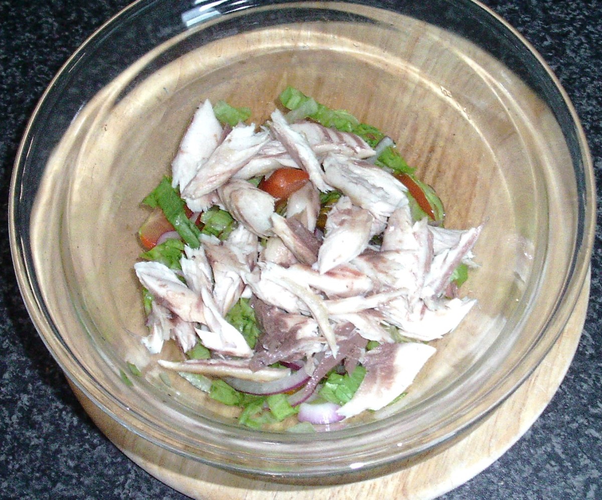 Smoked mackerel is added to other salad ingredients.