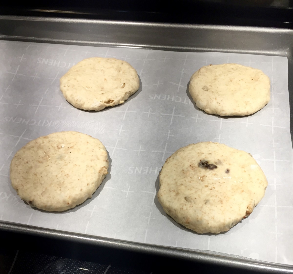 Place discs on prepared pans, cover, and allow to rise for 20 minutes before baking.
