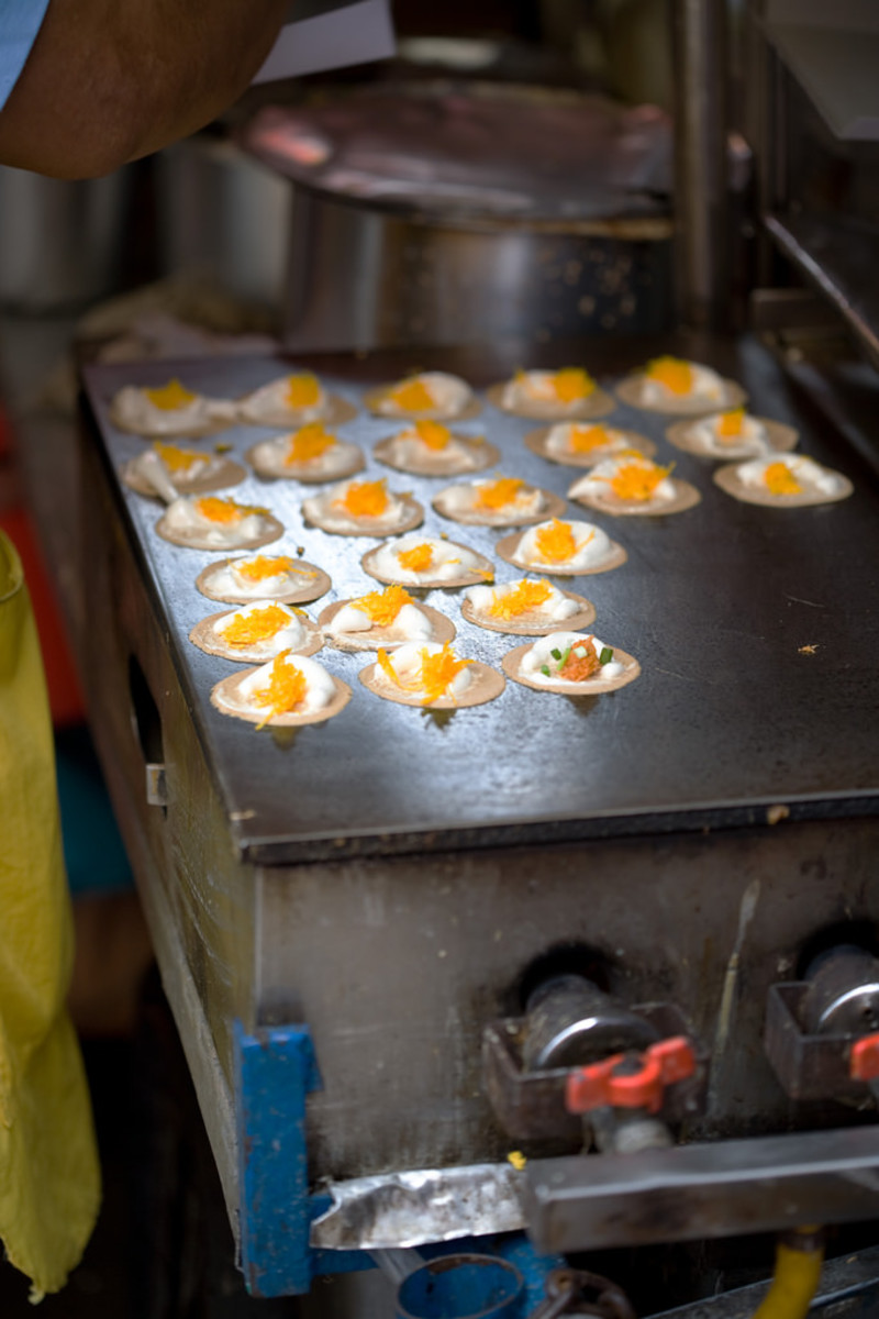 Khanom or crispy pancakes with egg yolk and marshmallow fluff
