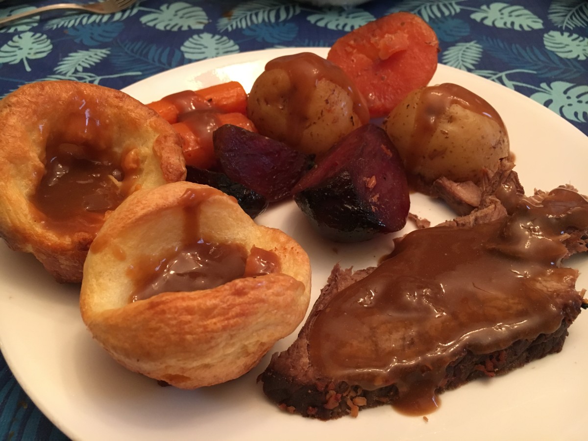 Roast beef, served with roasted carrots, potatoes and beets, with yorshire puddings and delicious gravy.