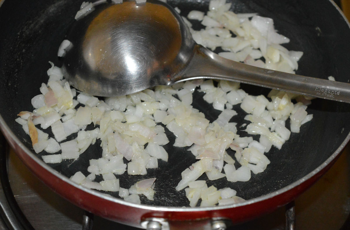 Step one: Heat oil in a pan. Throw in the chopped onions. Saute until they turn pinkish.