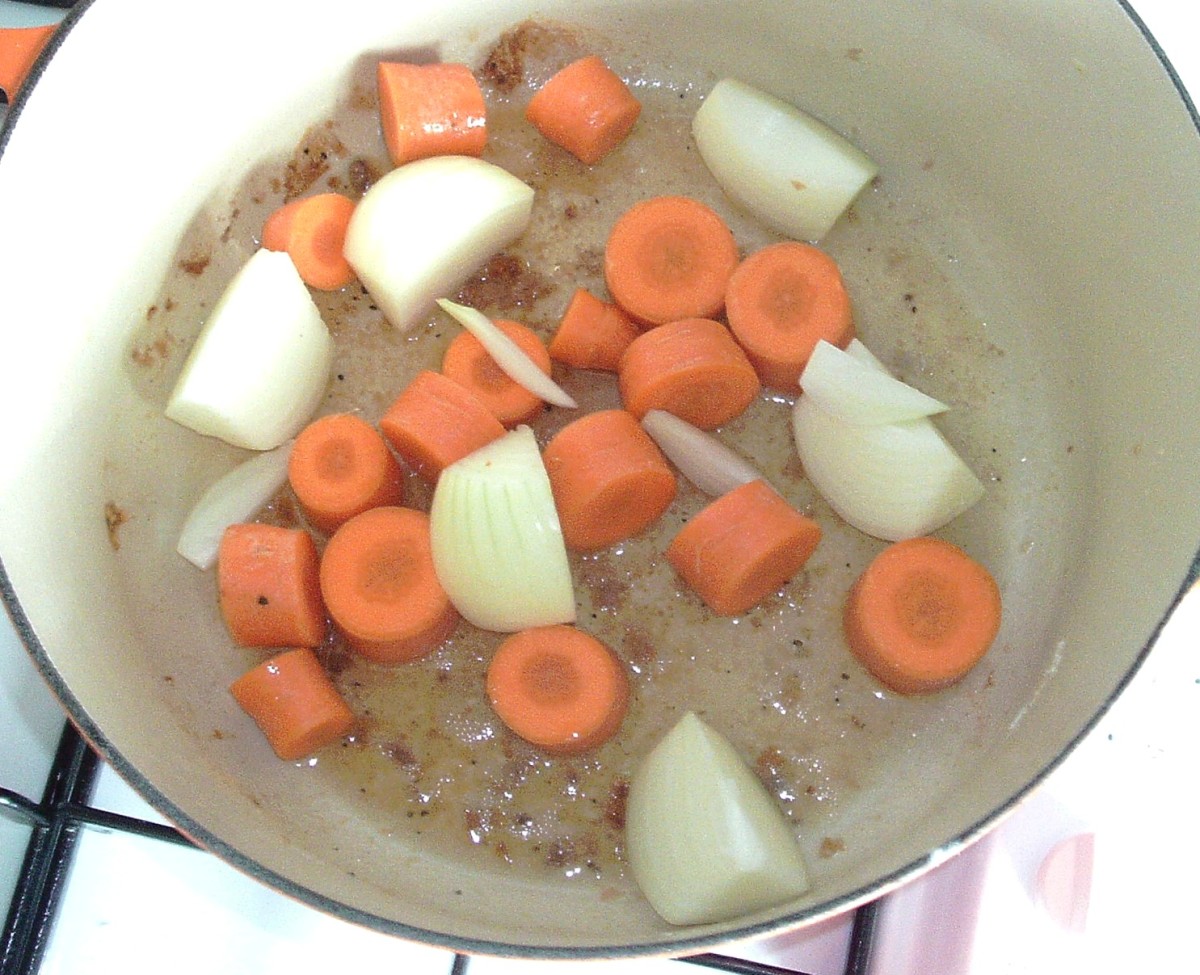 Onion and carrot is sauteed in game juices