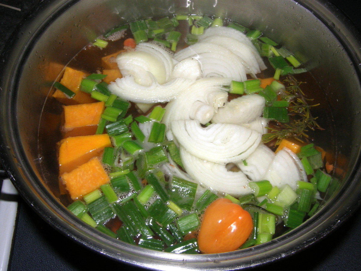 Add onions, scallions, habanero pepper, sweet peppers, and garlic.